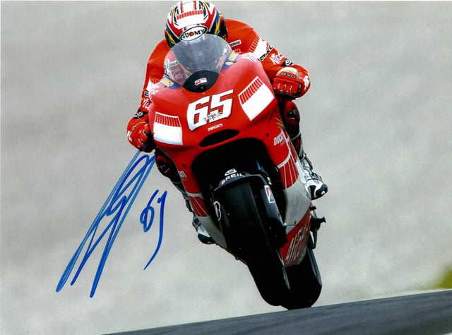 Fotografia autografata Loris Capirossi Ducati Desmosedici numero 65 MotoGP in impennata – autografo originale pennarello blu con numero 65 – 15,2x20,3 cm – condizioni Excellent