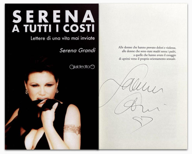 Libro autografato Serena Grandi – Serena a Tutti i Costi Gialloeditori – copertina e frontespizio con firma originale pennarello nero e disegno personale – 21x14 cm – condizioni Excellent