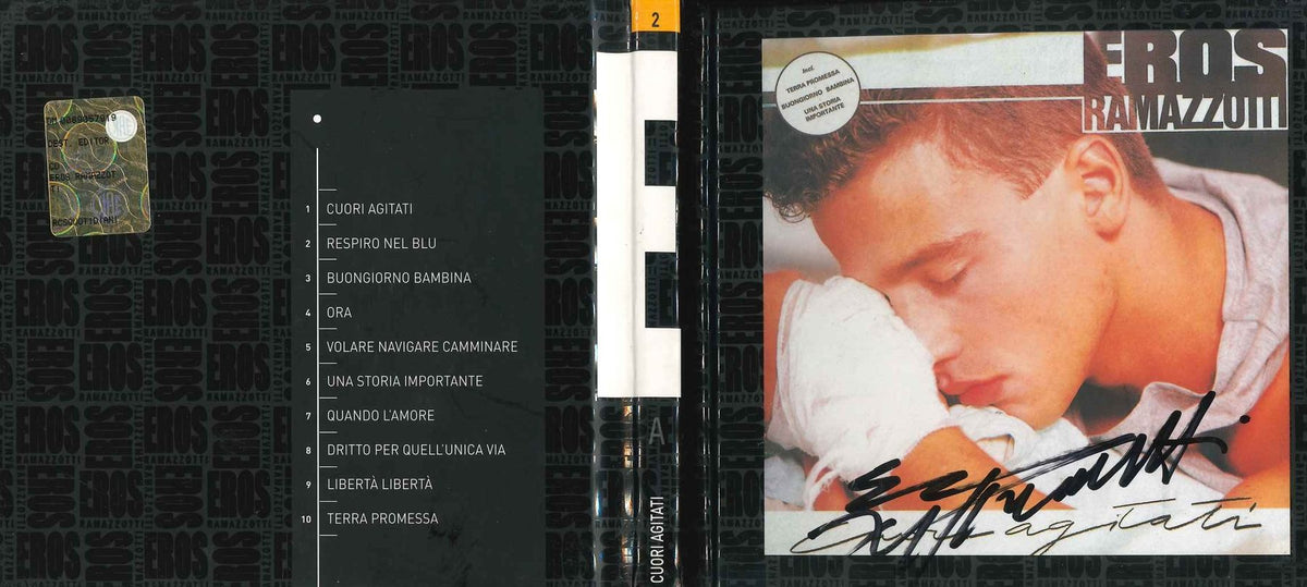 Digibook Cuori Agitati di Eros Ramazzotti aperto con tracklist, dorso e copertina autografata