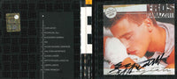 Digibook Cuori Agitati di Eros Ramazzotti aperto con tracklist, dorso e copertina autografata