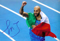 Fotografia autografata Marcell Jacobs esultanza bandiera Italia – autografo blu originale – MTM Memorabilia