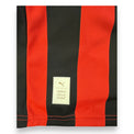 Dettaglio orlo maglia Milan 125° Anniversario – etichetta Puma Authentic Licensed Football