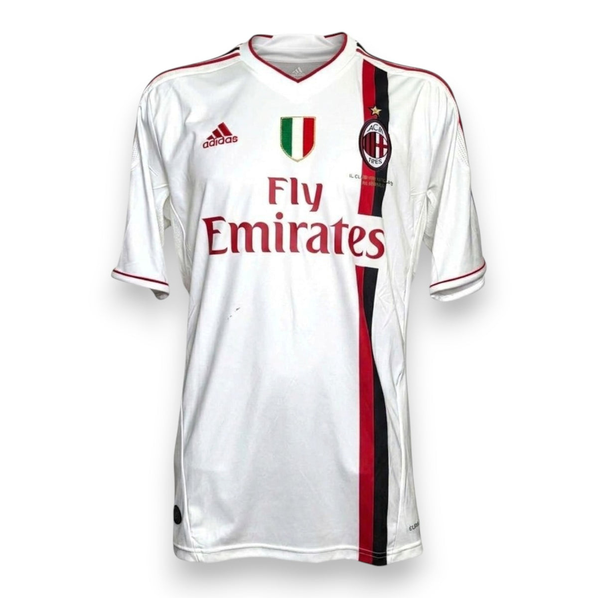 Maglia Milan Away 2011/12 Adidas bianca con banda rossonera, scudetto e sponsor Fly Emirates – fronte