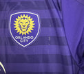 Stemma ricamato Orlando City SC leone dorato su maglia Home 2016 Adidas
