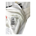 Etichetta interna Adidas con data 08/04 e codice articolo – maglia Real Madrid Home 2004/05