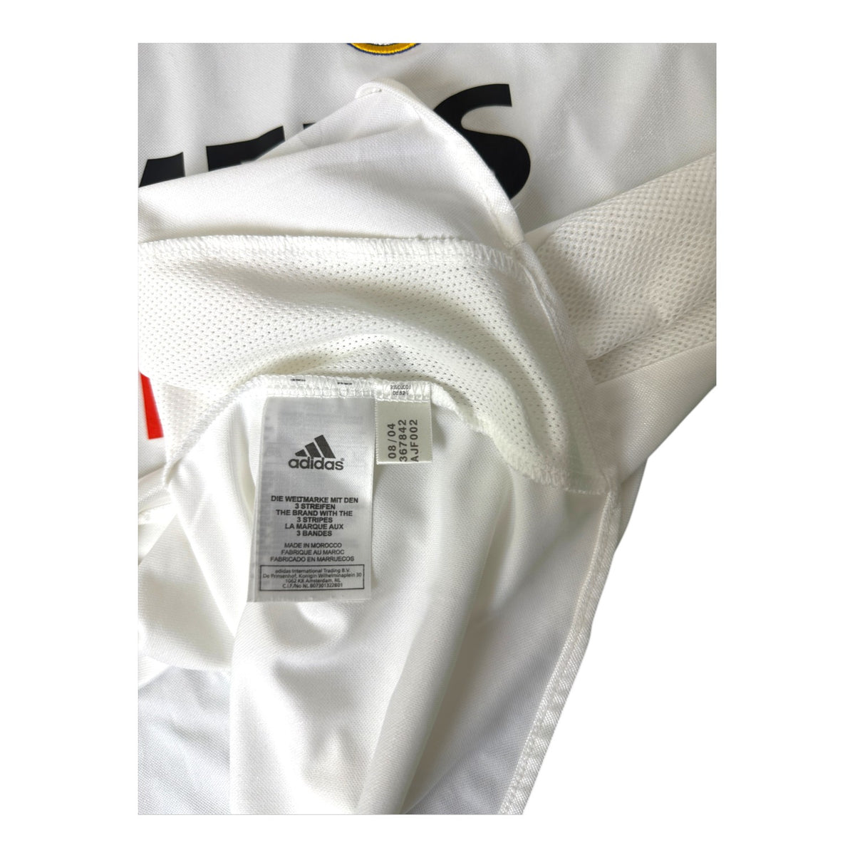 Etichetta interna Adidas con data 08/04 e codice articolo – maglia Real Madrid Home 2004/05