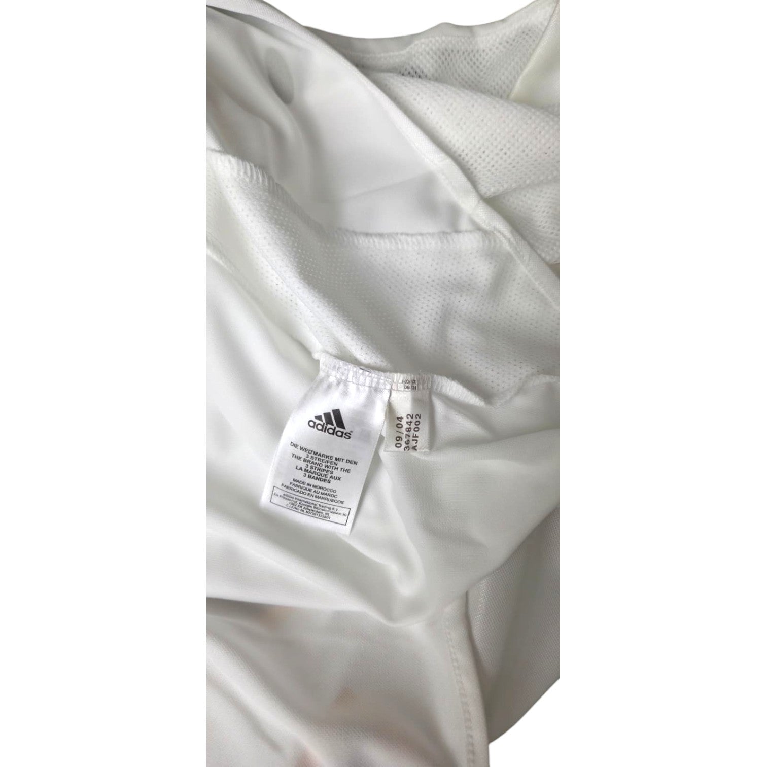 Dettaglio etichetta interna maglia Real Madrid 2004-05 Adidas – codice 09/04 Made in Morocco